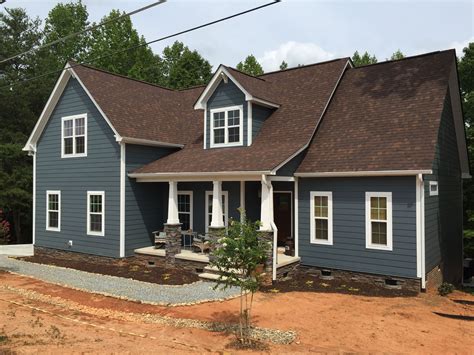 brown roof blue house exterior